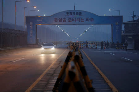 South Korean soldiers stand guard at a check point on the Grand Unification Bridge that leads to the truce village of Panmunjom, just south of the demilitarized zone separating the two Koreans, in Paju, South Korea, January 15, 2018. REUTERS/ Kim Hong-ji