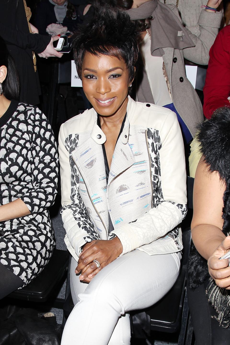 This image released by Starpix shows actress Angela Bassett at the Tracy Reese Fall 2013 show during Fashion Week in New York, Sunday, Feb. 10, 2013. (AP Photo/Starpix, Kristina Bumphrey)