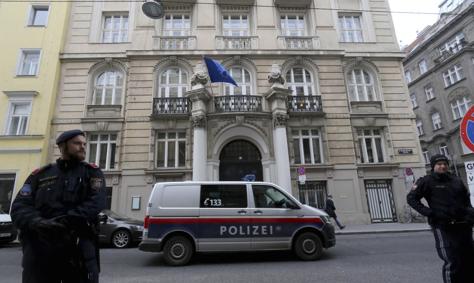 Police waits in front of a house where closed-door nuclear talks with Iran take place in Vienna, Austria, Friday, Dec. 6, 2019. (AP Photo/Ronald Zak)