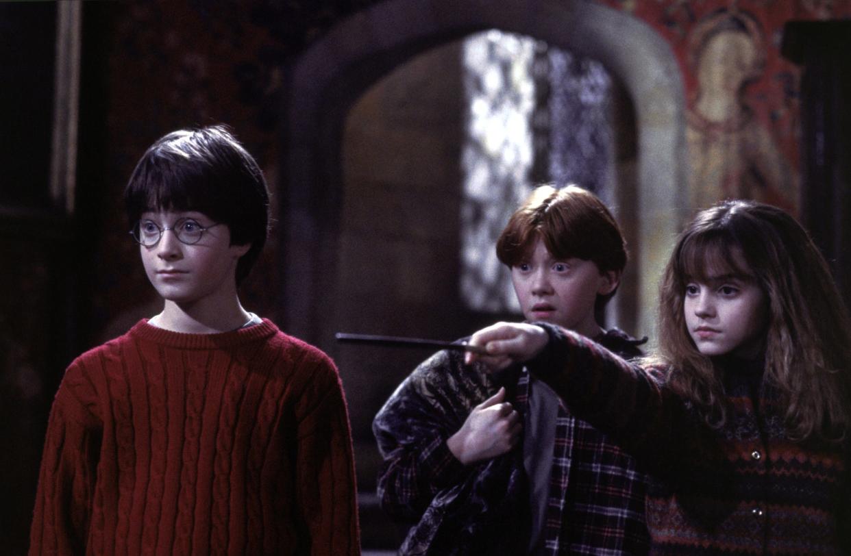 Harry Potter (Daniel Radcliffe, left), Ron Weasley (Rupert Grint) and Hermione Granger (Emma Watson) in "Harry Potter and the Sorcerer’s Stone."