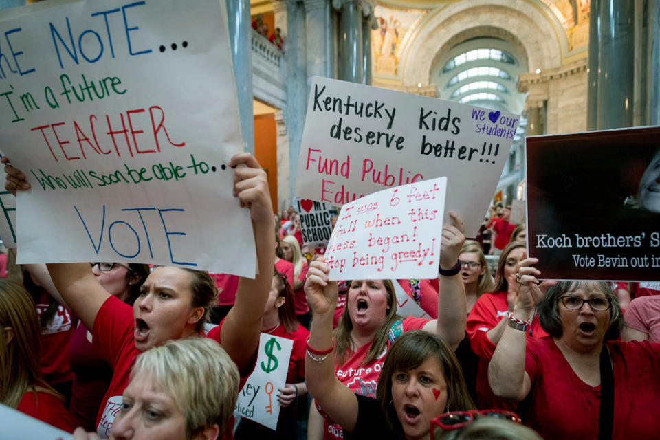 FILE - In this April 13, 2018, file photo, teachers from across Kentucky gather inside the state Capitol to rally for increased funding for education, Frankfort, Ky. Months after massive teacher walkouts energized many like never before, teachers and their unions are coming to terms with the midterm elections' mix of wins and losses. (AP Photo/Bryan Woolston, File)