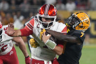 Arizona State defensive back Timarcus Davis (7) tackles Utah quarterback Cameron Rising during the second half of an NCAA college football game Saturday, Sept. 24, 2022, in Tempe, Ariz. (AP Photo/Rick Scuteri)