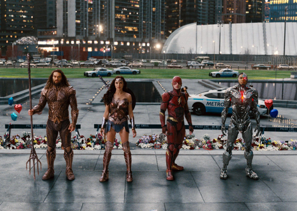 This image released by Warner Bros. Pictures shows Jason Momoa, from left, Gal Gadot, Ezra Miller and Ray Fisher in a scene from "Justice League." Fisher, who played Cyborg in the DC Comics film directed by Josh Whedon, tweeted Wednesday that Whedon's treatment of the cast and crew was “unprofessional and completely unacceptable.” Whedon has not responded to Fisher on social media, and emails seeking comment were not immediately returned. (Warner Bros. Entertainment Inc. via AP)