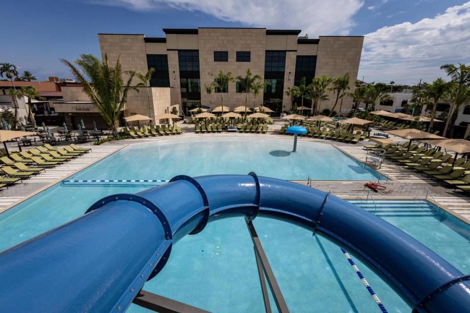 Health club and gym Life Time opened on Friday, Aug. 4, 2023, at The Falls shopping mall in Kendal. Above: A view of the outdoor saltwater pool from the top of the water slide in Life Time.