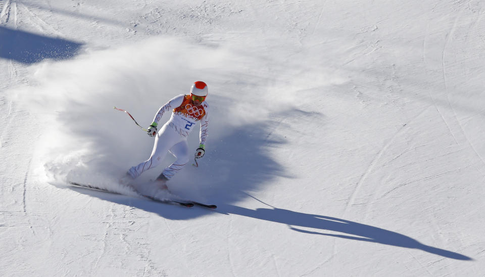 United States' Marco Sullivan comes to a halt at the end of a men's downhill training run for the Sochi 2014 Winter Olympics, Saturday, Feb. 8, 2014, in Krasnaya Polyana, Russia. (AP Photo/Christophe Ena)