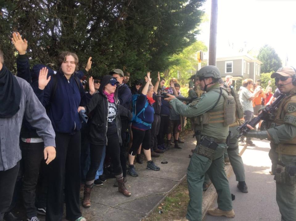 Police officers&nbsp;corner a group of counterprotesters at a neo-Nazi rally in Georgia on Saturday. (Photo: Christopher Mathias HuffPost)