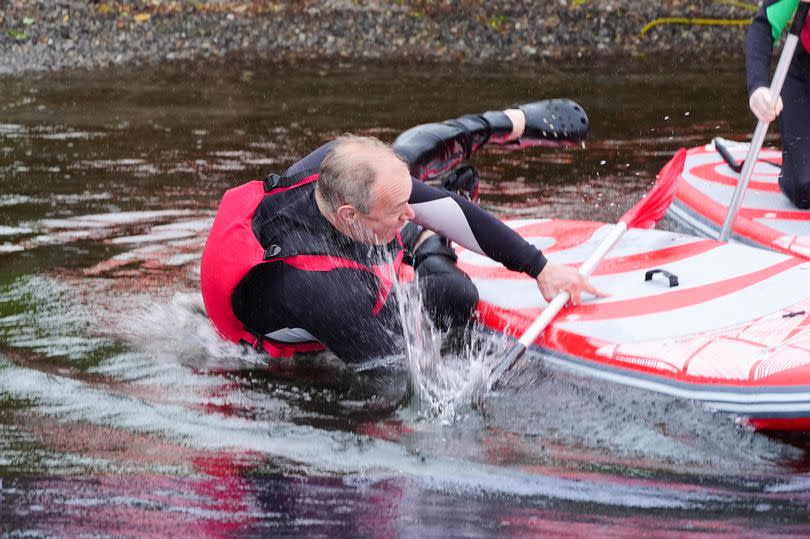 Liberal Democrat Leader Sir Ed Davey falls into the water while paddleboarding on Lake Windermere, while on the General Election campaign trail.