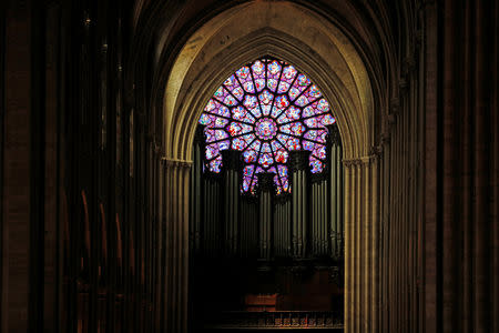 A view shows the organ and a rose window inside the Notre Dame Cathedral in Paris, France, August 28, 2017. Officials at the 854-year old Notre-Dame cathedral, France's most-visited monument, say it is in urgent need of raising 100 million euros ($120.40 million) to repair everything from damaged arches and statutes to broken down gargoyles. REUTERS/Philippe Wojazer