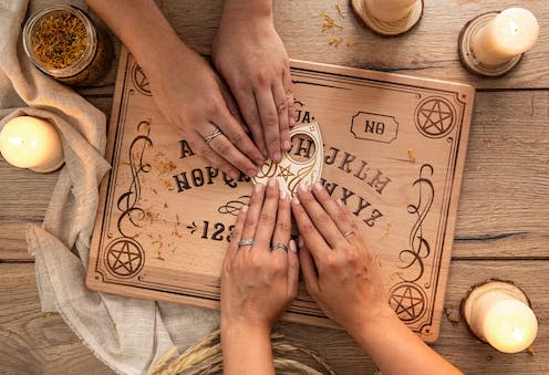   <span class="attribution"><a class="link " href="https://www.shutterstock.com/image-photo/ouija-board-candles-arrangement-above-view-2172537103" rel="nofollow noopener" target="_blank" data-ylk="slk:Artman96 / Shutterstock;elm:context_link;itc:0;sec:content-canvas">Artman96 / Shutterstock</a></span>