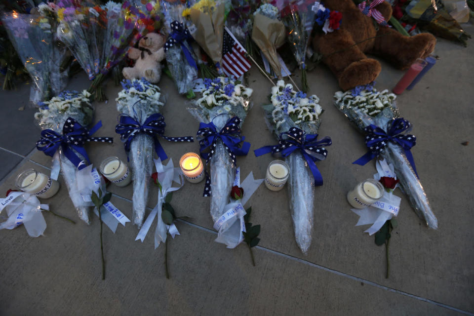 Candles and flowers placed in honor of slain Dallas police officers