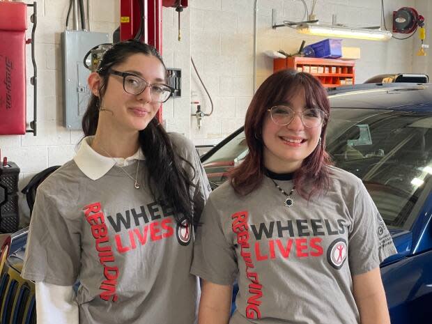 Cielle Levesque and Graziella Mocri, Grade 10 students at École secondaire catholique E.J. Lajeunesse, were in the Windsor, Ont., class of students who refurbished a 2011 Jeep Compass that was then given away to a family in need.  