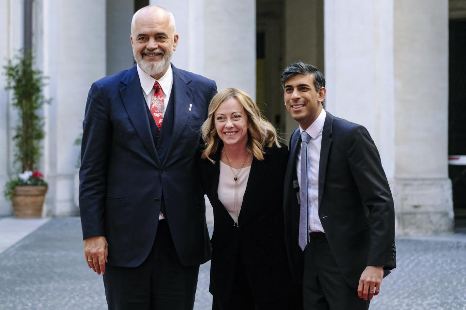 Italy's Prime Minister Giorgia Meloni, centre welcomes Britain's Prime Minister Rishi Sunak, right and Albania's Prime Minister Edy Rama, at Chigi Palace, in Rome, Saturday, Dec. 16, 2023. (Mauro Scrobogna/LaPresse via AP)