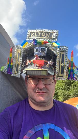Alex McGuire wearing his Elton John-themed hat at last year's festival 