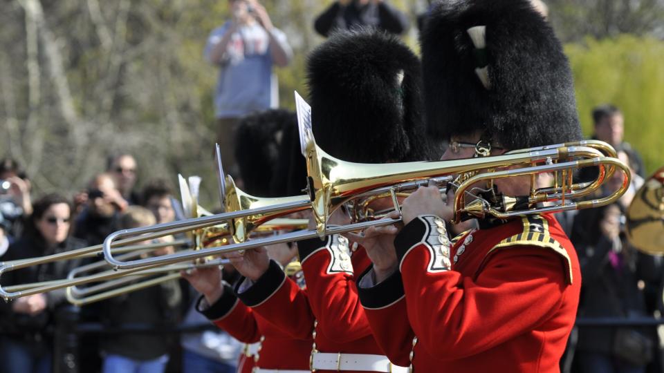 Guardsmen play trumpets at Changing of the Guard