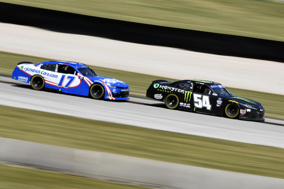ELKHART LAKE, WISCONSIN - JULY 02: Ty Gibbs, driver of the #54 Monster Energy Toyota, and Kyle Larson, driver of the #17 Hendrickcars.com Chevrolet, race during the NASCAR Xfinity Series Henry 180 at Road America on July 02, 2022 in Elkhart Lake, Wisconsin. (Photo by Logan Riely/Getty Images) | Getty Images