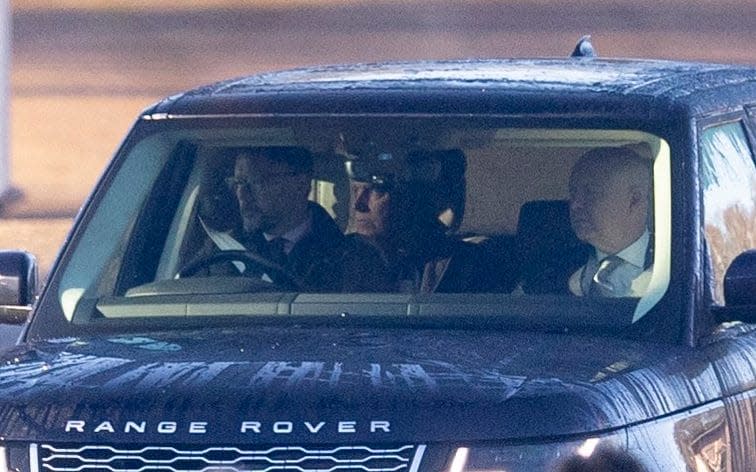 Prince Andrew, in the rear seat, with Gary Bloxsome, his London-based lawyer, in the passenger seat as they are driven to Windsor Castle on Thursday morning - Kelvin Bruce