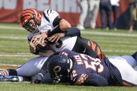 Cincinnati Bengals quarterback Joe Burrow is sacked by Chicago Bears outside linebacker Khalil Mack (52) and Robert Quinn during the first half of an NFL football game Sunday, Sept. 19, 2021, in Chicago. (AP Photo/Nam Y. Huh)