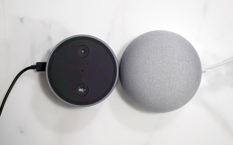 The new Google Home Mini (right) has clearly been inspired by the Amazon Echo Dot (left).