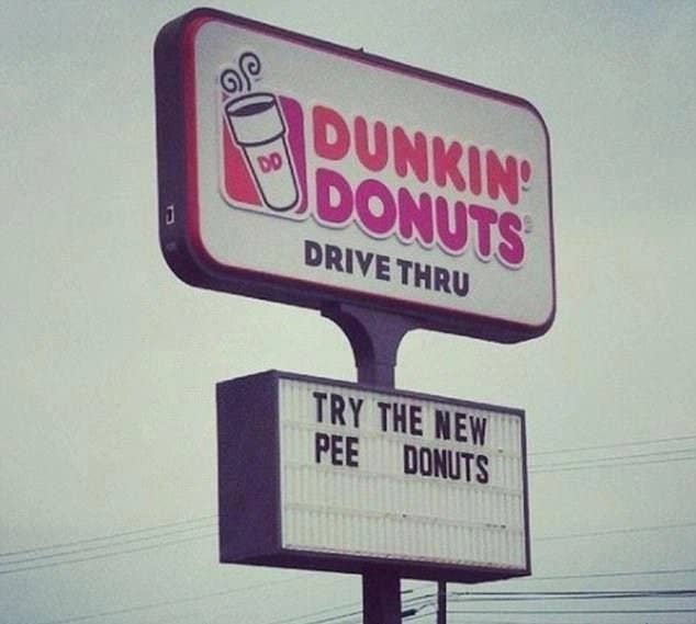 sign reading try the new pee donuts