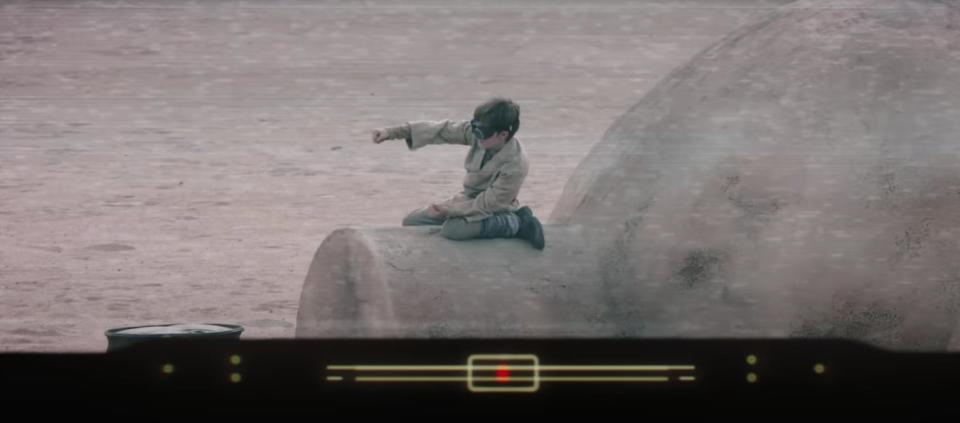 Young Luke Skywalker playing in the desert