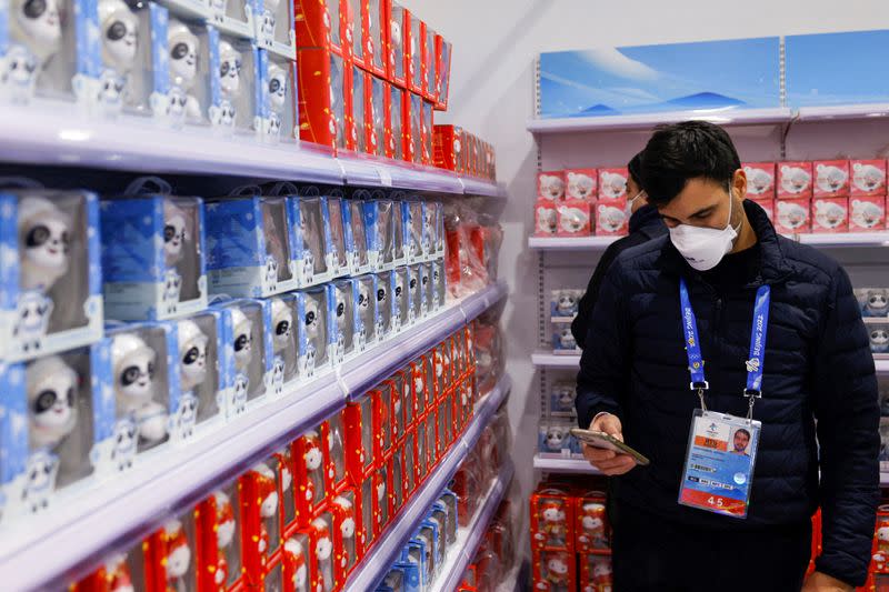 Bing Dwen Dwen and Shuey Rhon Rhon, mascots of the Beijing 2022 Winter Olympics and Paralympics, are displayed at a souvenir shop at the Main Press Centre, in Beijing