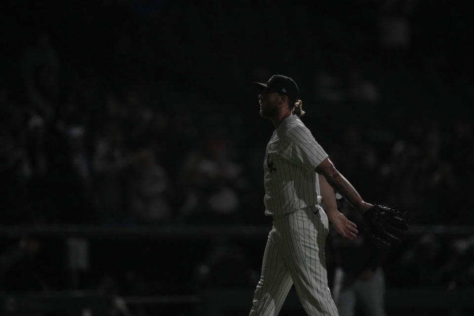Chicago White Sox pitcher <a class="link " href="https://sports.yahoo.com/mlb/players/10412/" data-i13n="sec:content-canvas;subsec:anchor_text;elm:context_link" data-ylk="slk:Michael Kopech;sec:content-canvas;subsec:anchor_text;elm:context_link;itc:0">Michael Kopech</a> begins to celebrate as the stadium lights flash after the team’s 3-2 win over the Cleveland Guardians in a baseball game Thursday, May 9, 2024, in Chicago. (AP Photo/Charles Rex Arbogast)