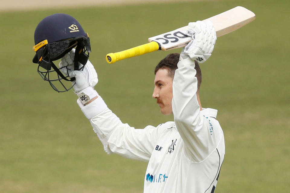 Nic Maddinson of Victoria celebrates after reaching a century during day one of the Sheffield Shield match between Victoria and South Australia. (Photo by Daniel Pockett/Getty Images)