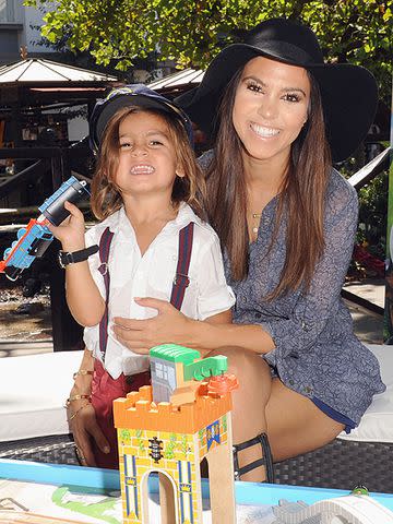 Getty Kourtney Kardashian and Mason Disick at an event