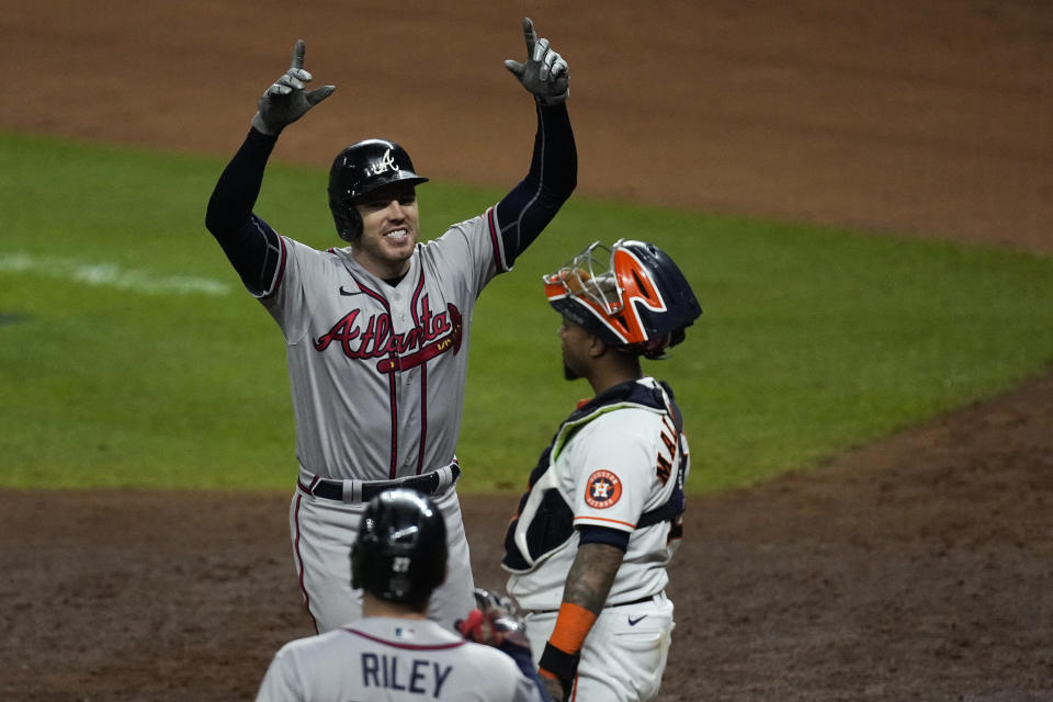 Atlanta Braves' Freddie Freeman celebrates after a home run during the seventh inning in Game 6 of baseball's World Series between the Houston Astros and the Atlanta Braves Tuesday, Nov. 2, 2021, in Houston. (AP Photo/Ashley Landis)