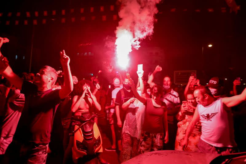 Supporters of Tunisia's President Kais Saied gather on the streets after he dismissed the government and froze parliament, in Tunis