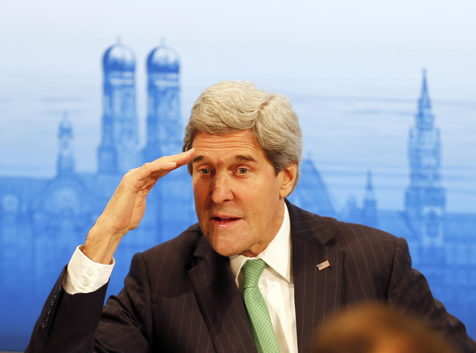 US Secretary of Foreign Affairs John Kerry salutes as he attends the 50th Security Conference in Munich, Germany, Saturday, Feb. 1, 2014. The conference on security policy takes place from Jan. 31, 2014 until Feb. 2, 2014. (AP Photo/Frank Augstein)