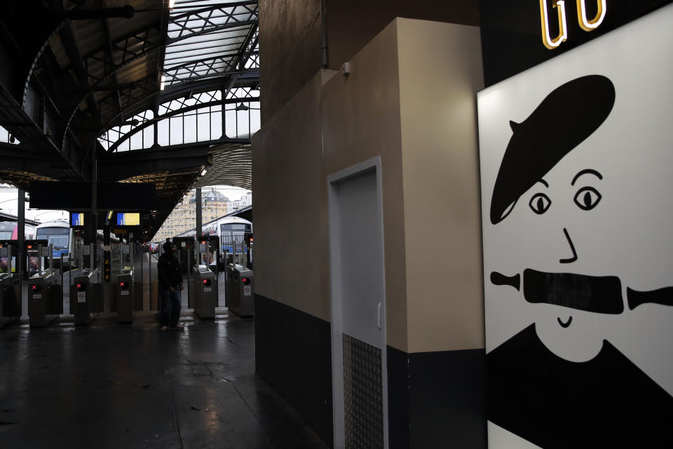 Trains platforms are empty next to a bakery sign at Gare de L'Est train station in Paris, Saturday, Dec. 7, 2019. French strikes are disrupting weekend travel around the country, as truckers blocked highways and most trains remained at a standstill because of worker anger at President Emmanuel Macron's policies as a mass movement against the government's plan to redesign the national retirement system entered a third day. (AP Photo/Francois Mori)