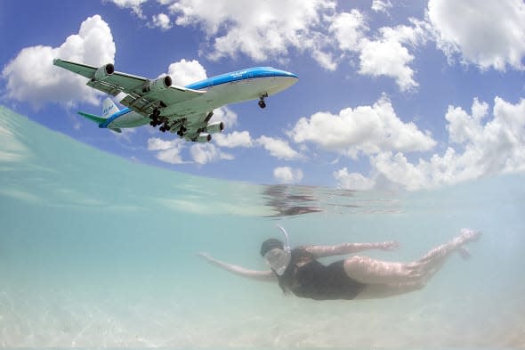 Amazing pics as jumbo jets photobomb tourists at tropical Caribbean resort