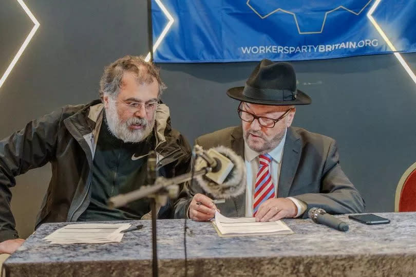 Workers Party of Britain candidate Hoz Shafiei (L) next to party founder and Rochdale MP George Galloway