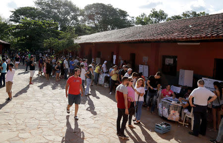 People queue to cast their votes during Paraguay's national elections in the outskirts of Asuncion, Paraguay April 22, 2018. REUTERS/Jorge Adorno