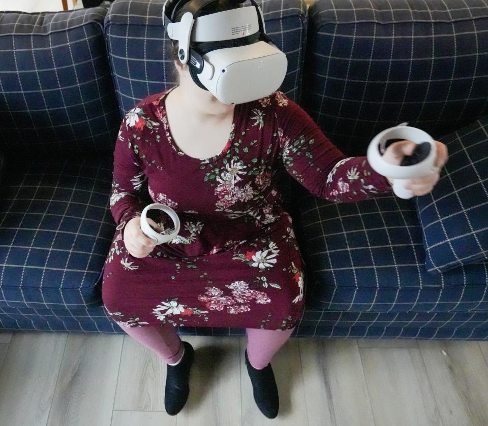 Gemma Firth uses her VR headset to create social connections from her home in New Berlin.