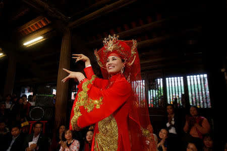 Medium Nguyen Bich Thuy performs during a Hau Dong ceremony at Kiep Bac temple in Hai Duong province in Vietnam, February 11, 2017. REUTERS/Kham