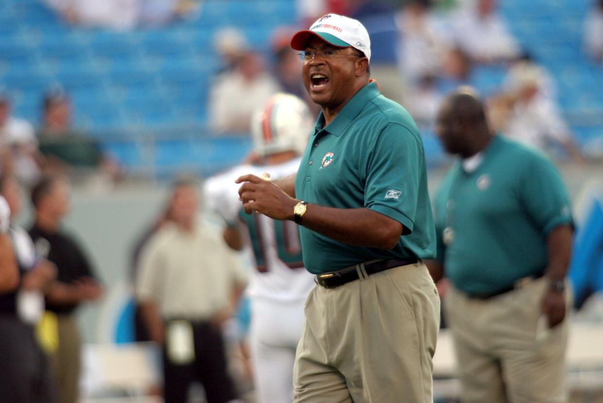 Miami Dolphins Assistant Coach Charlie Baggett, an E.E. Smith High graduate, gives instructions to his players at the Bank of America Stadium before the team took on Carolina in 2006.