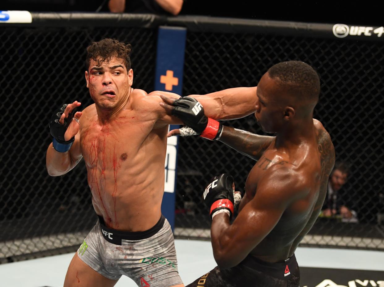 Israel Adesanya (right) retained his middleweight title by finishing Paulo Costa (Zuffa LLC)