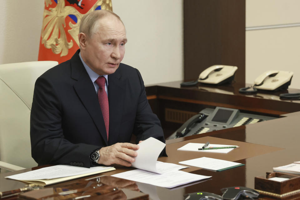 Russian President Vladimir Putin chairs a meeting with members of the government via videoconference at the Novo-Ogaryovo state residence, outside Moscow, Russia, Wednesday, July 10, 2024. (Vyacheslav Prokofyev, Sputnik, Kremlin Pool Photo via AP)