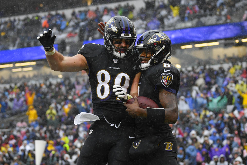 Baltimore Ravens quarterback Lamar Jackson (8) celebrating his touchdown with teammate tight end Mark Andrews (89) in the first half of an NFL football game, Sunday, Dec. 1, 2019, in Baltimore, Md. (AP Photo/Nick Wass)