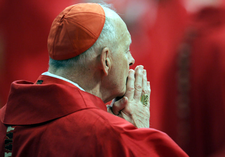 FILE - In this Monday, April 18, 2005 file photo, U.S. Cardinal Theodore Edgar McCarrick attends a Mass in St. Peter's Basilica at the Vatican. On Saturday, Feb. 16, 2019 the Vatican announced Pope Francis defrocked former U.S. Cardinal Theodore McCarrick after Vatican officials found him guilty of soliciting for sex while hearing Confession. (AP Photo/Pier Paolo Cito, files)