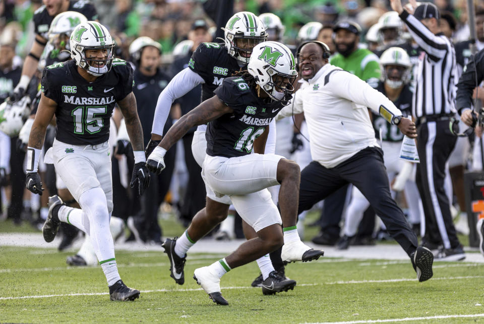 Marshall's Elijah Russel (16) celebrates after a tackle on special teams against Arkansas State during an NCAA college football game Saturday, Nov. 25, 2023, in Huntington, W.Va. (Sholten Singer/The Herald-Dispatch via AP)