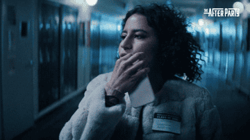 Ilana Glazer zipping her lips and dangling the key