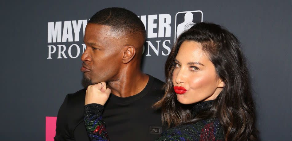 Actors Jamie Foxx (L) and Olivia Munn arrive on T-Mobile's magenta carpet duirng the Showtime, WME IME and Mayweather Promotions VIP Pre-Fight Party for Mayweather vs. McGregor at T-Mobile Arena on August 26, 2017 in Las Vegas, Nevada.