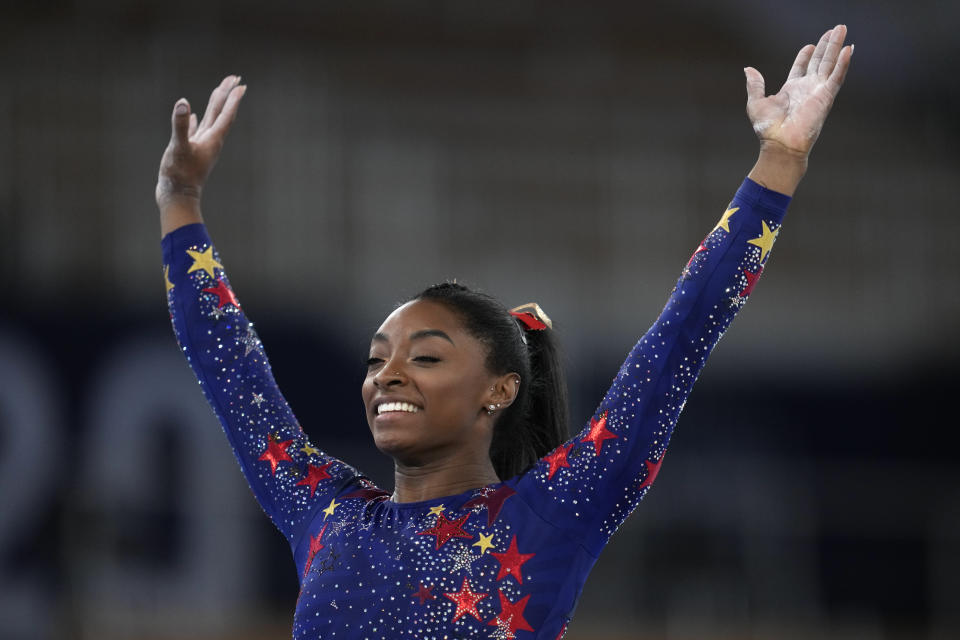 Simone Biles, of the United States, performs her floor routine during the women's artistic gymnastic qualifications at the 2020 Summer Olympics, Sunday, July 25, 2021, in Tokyo. (AP Photo/Natacha Pisarenko)