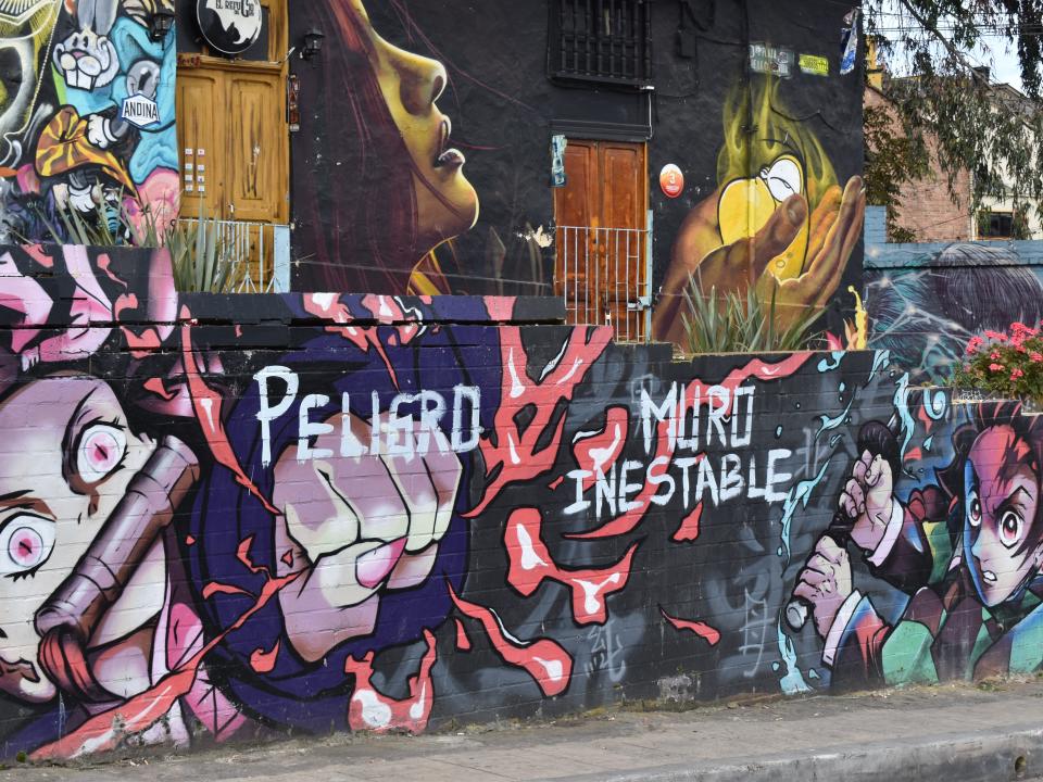 Nick Dauk Bogotá Colombia travel layover Different style murals in Distrito Graffiti.