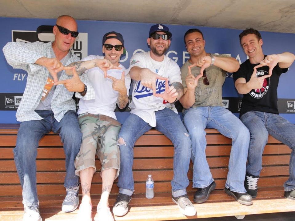 David Mickey Evans (left) with some Sandlot cast members at Dodger Stadium five years ago, giving the movie's "L-7 Weenie" gesture.