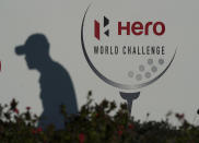 The shadow of Collin Morikawa of the United States, is cast on a banner promoting the Hero World Challenge PGA tour, at the Albany Golf Club in New Providence, Bahamas, Wednesday, Dec. 1, 2021.(AP Photo/Fernando Llano)