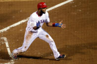 ARLINGTON, TX - OCTOBER 23: Elvis Andrus #1 of the Texas Rangers celebrates after scoring in the first inning during Game Four of the MLB World Series against the St. Louis Cardinals at Rangers Ballpark in Arlington on October 23, 2011 in Arlington, Texas. (Photo by Rob Carr/Getty Images)